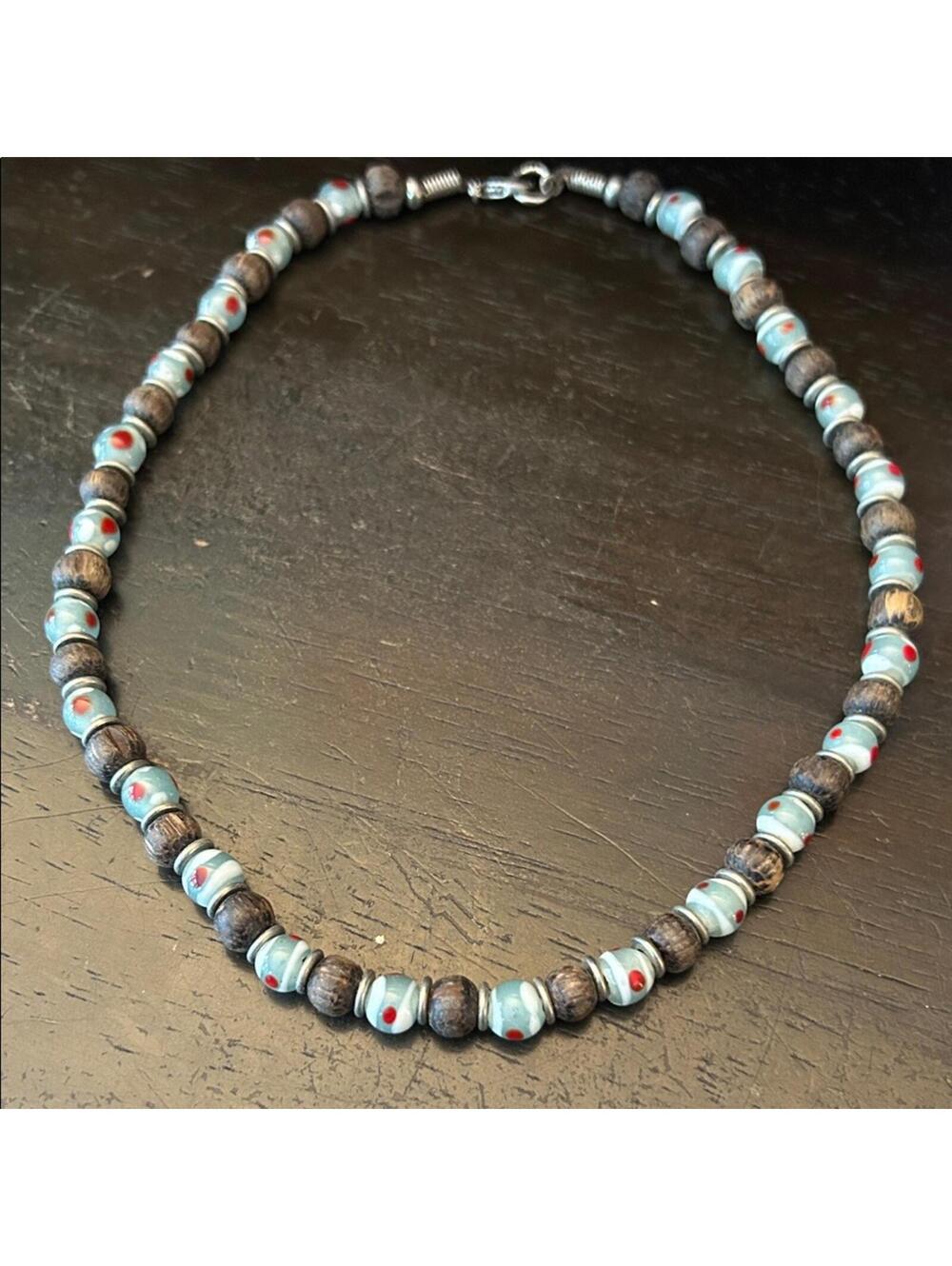 Elegant Beaded Necklace with Blue and Red Accents